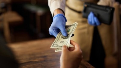 Cash laws: New tipping legislation will come into force on 1 July (Credit: Getty/Drazen Zigic)