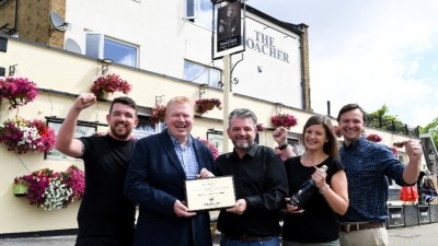 Cheers: Greene King Pub Partners gifted McGrath a plaque