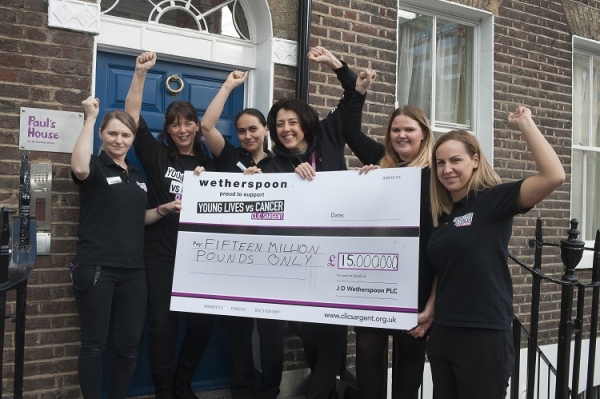 CLIC Sargent staff with £15m giant cheque outside Paul's House, CLIC Sargent's London Home from Home