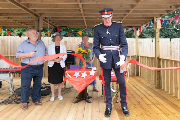 David Fursdon, Lord Lieutenant of Devon, cuts the ribbon to officially open the craft cabin copy