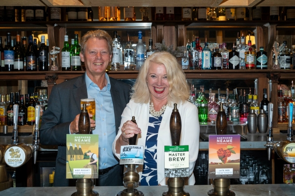 Shepherd Neame Chief Executive Jonathan Neame with Visit Kent CEO Deidre Wells OBE pulling the first pint