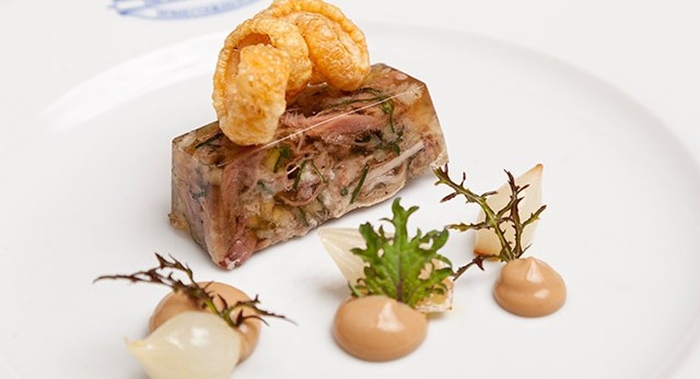 Kingham Plough's pigs head terrine, homemade mustard, pickled baby onions and pork scratchings
