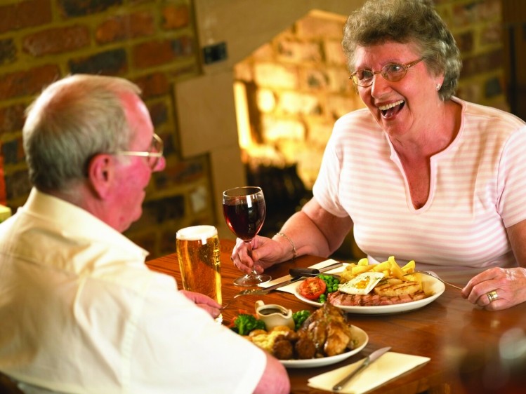 Whitbread: older couple dining out