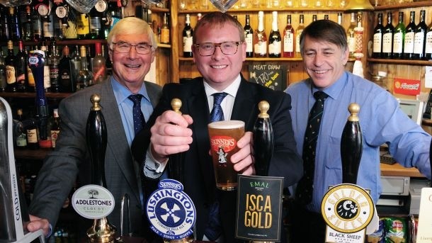 Pubs minister Marcus Jones with John Longden from Pub is the Hub and licensee Mark Graham (right)
