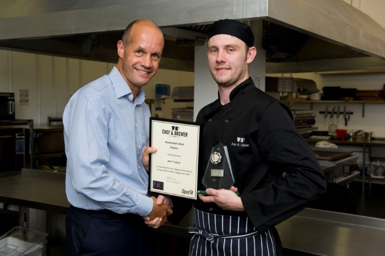 Chef & Brewer Masterchef 2014 winner: Brett Leech, chef at the Axe & Cleaver in Altrincham, Greater Manchester receives his award from Nick Young, operations director for the managed division