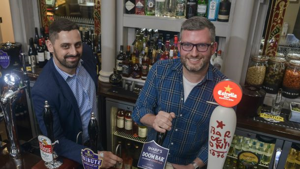 Cheers: new publicans Ed Clifton (right) and Lukasz Adamczyk toast the new-look Brunel