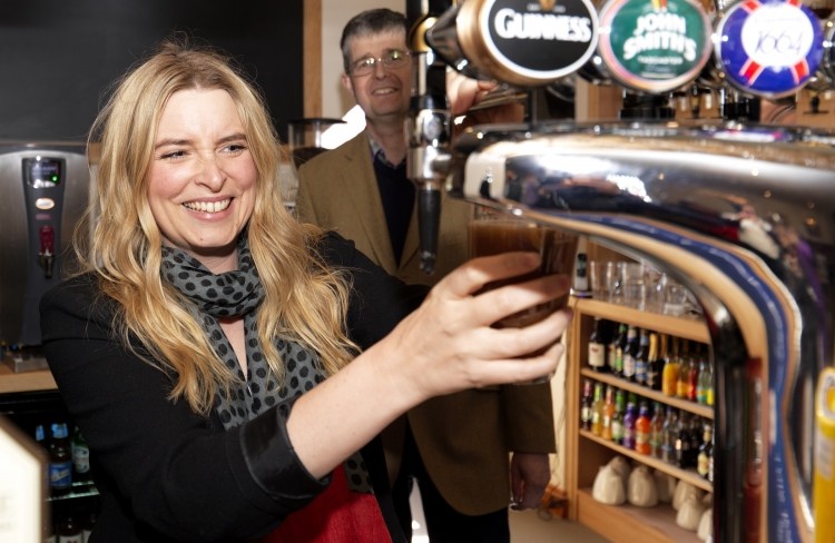 Emma Atkins pulling the first pint