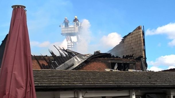 Gutted: Hampton pub's first floor and roof destroyed by fire (Image by London Fire Brigade)
