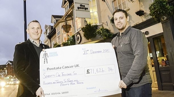 The cheque is presented to Prostate Cancer UK outside the George Twickenham 