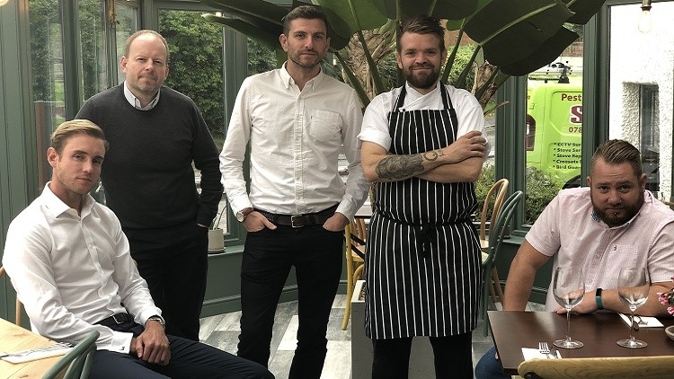 Big hitters: at the opening of their second pub, the Tap & Run, in Nottinghamshire, directors Stuart Broad, Dan Cramp and Harry Gurney, head chef Andrew Smith and general manager Tom Howard