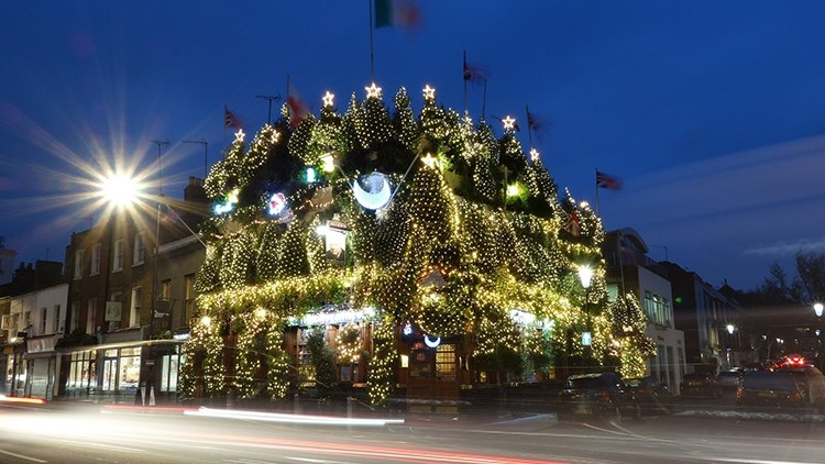 That's the spirit: the Churchill Arms has become the talk of the town with its extravagant Christmas decoration display