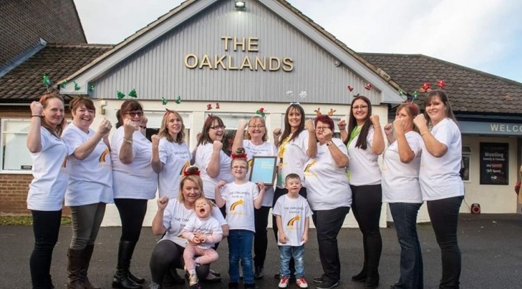 Class act: pub staff and punters performed a sign-a-long for Oliver Callis, who has Down's syndrome