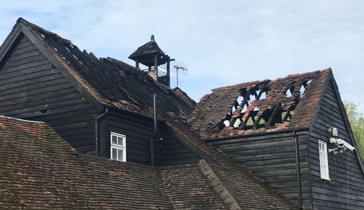 Roof destroyed: Ye Olde Six Bells in Horley has been left in a sorry state after fire