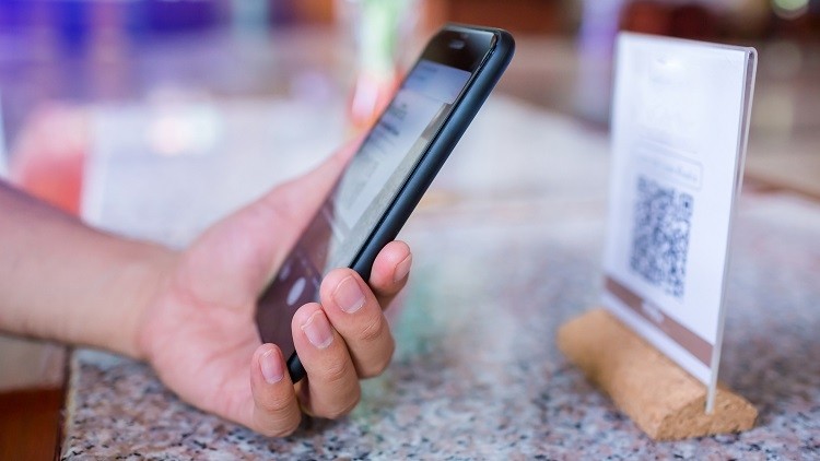 Test and Trace: pub staff do not have to check a customer's phone to ensure they have scanned a QR code for contact-tracing purposes (image: Getty/ Koonsiri Boonnak)