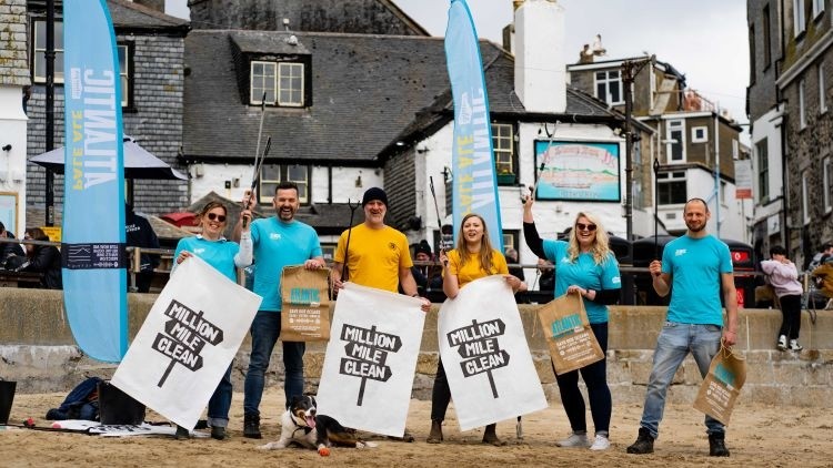 Cleaning up: volunteers helping to clean beaches in the south-west of England can claim a free pint of beer