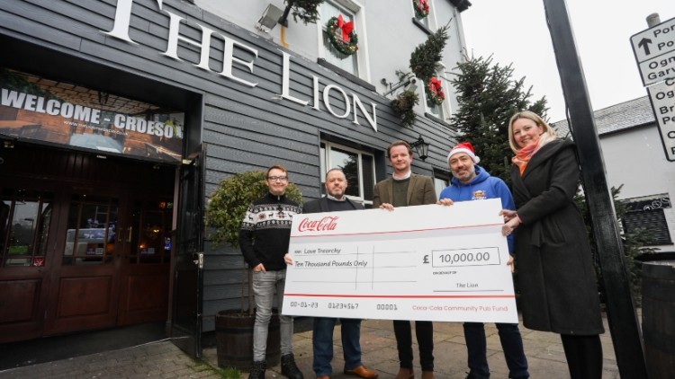 Cheque this out: Connor Hall (Rhondda Cynon Taf County Borough Council), Adrian Emmett (owner of The Lion), Daniel Lawrence (Coca-Cola), Emyr Webster and Angharad Walters (Love Treorchy)