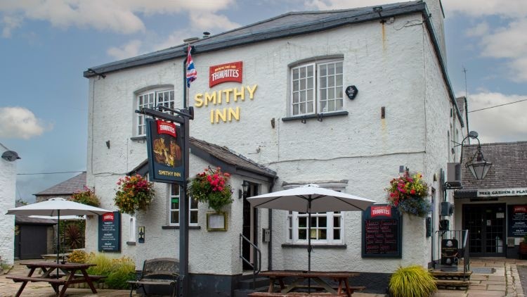 Sector service: licensees of the Smithy Inn, Tom and Pam Baxter have been behind the bar for 35 years