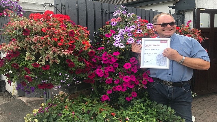 Blooming proud: Doug Wilkinson of the Shoal Hill Tavern won the Pubs in Bloom contest