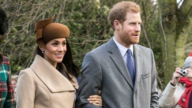 Cheers: Prince Harry and Meghan Markle were welcomed at a Nicholson's Pubs site in Belfast (Image: Mark Jones)