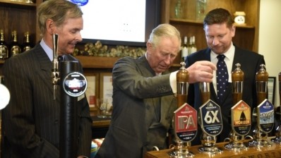 Toast: Prince Charles pulls a pint of 6X to celebrate Pub is the Hub