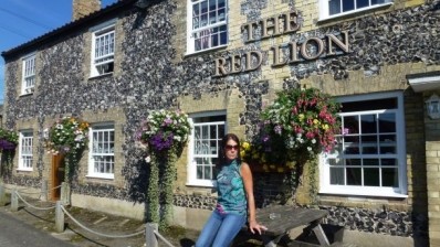 Woman drinks at every Red Lion pub