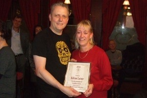 Adrian Larner being presented with his certificate by Christine Cryne of CAMRA