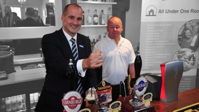 A question of priorities: Jake Berry at the pump with Keith Murray, licensee of Star Pubs & Bars' Woolpack