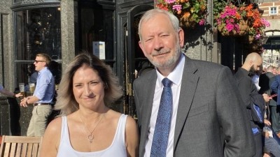 NPW celebrates 25 years: (pictured) Steve Baker NPW chair presenting Sofia Vancke manager at the Red Lion pub in Westminster a commemorative coin