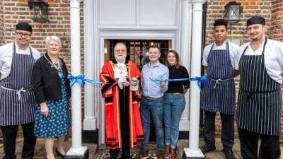 New site: the Mayor of Hillingdon (centre) cut the ribbon to open the pub