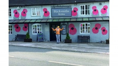 In full bloom: publican Danii Molloy has decorated the Blacksmiths Arms in honour of Remembrance Day