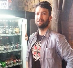 Jospeh Ryan with the beer vending machine