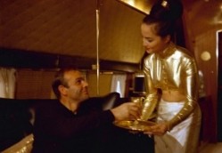Sean Connery as James Bond enjoying a martini in Goldfinger