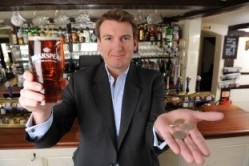 Taxing issue: Brakspear chief Tom Davies with the £1.80 cost of a pint