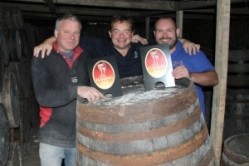 Patrick McCaig from Otter Brewery (centre), with barrel roller Dave Strawbridge (left) and Volunteer Inn landlord Mike Down