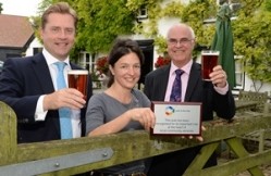 Mark Blythman from Greene King with Juliette Chapman, licensee at the Queen’s Head and Terry Stork from Pub is the Hub