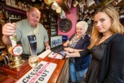 Landlord Hefin Evans, with his wife Megan and Samantha Allan, Pub is the Hub co-ordinator for Ceredigion Council