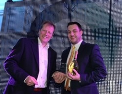 Luminar chief executive Peter Marks presenting General Manager of the Year, Russell Quelch from Oceana Southampton with his award