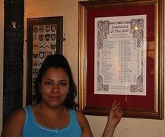 Linda Quintana with the roll of honour for previous landlords