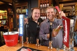 Reward: Landlord Phil Cutter (right) was persuaded to install Budweiser by local regular Mark Boast (left)